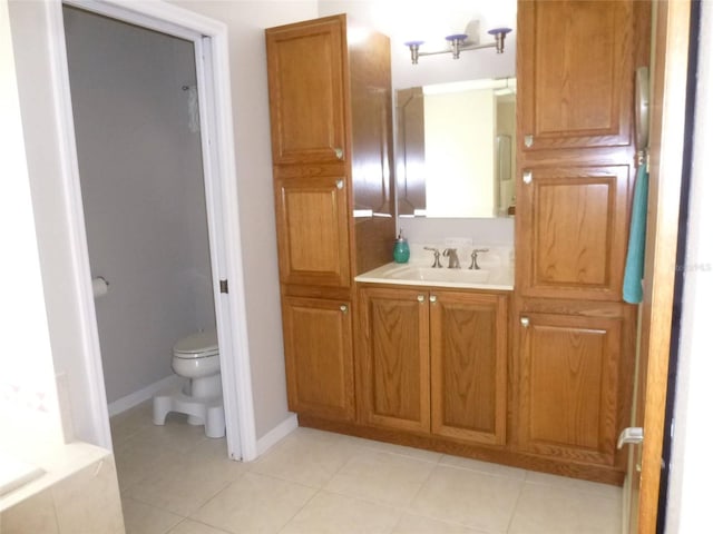 bathroom with tile patterned floors, vanity, and toilet