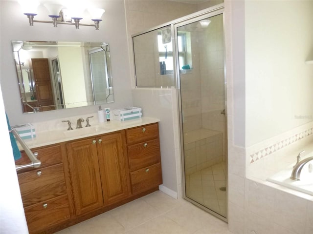 bathroom with vanity, tile patterned flooring, and separate shower and tub