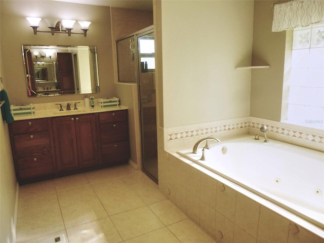 bathroom featuring independent shower and bath, vanity, and tile patterned flooring