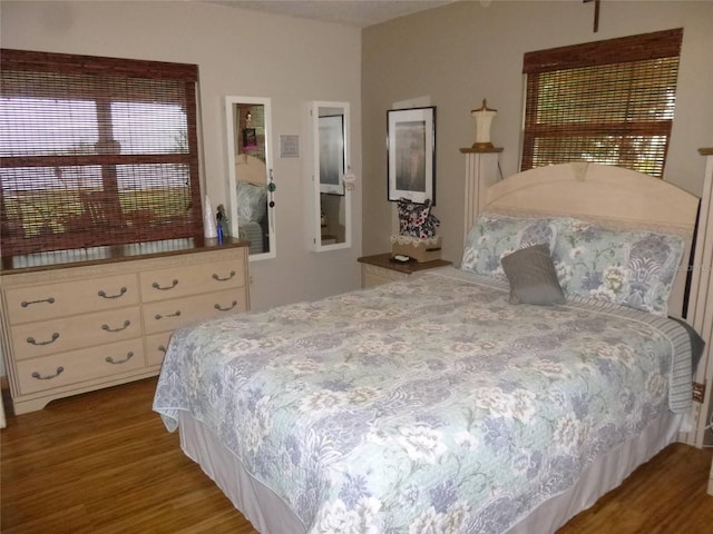 bedroom with hardwood / wood-style flooring