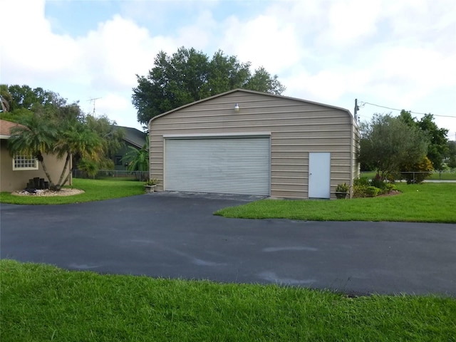 garage featuring a yard