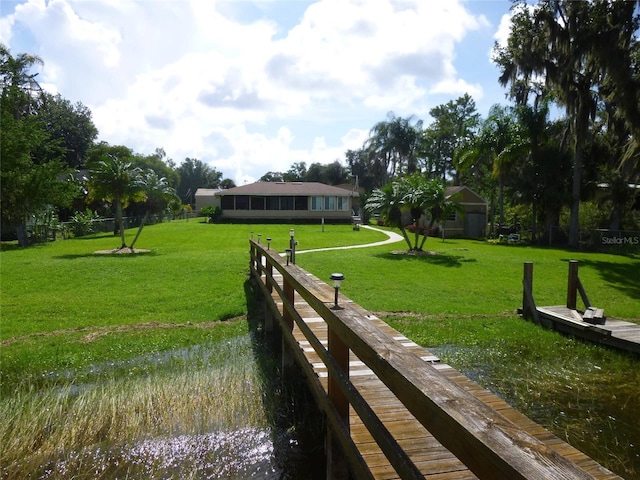 view of community featuring a yard