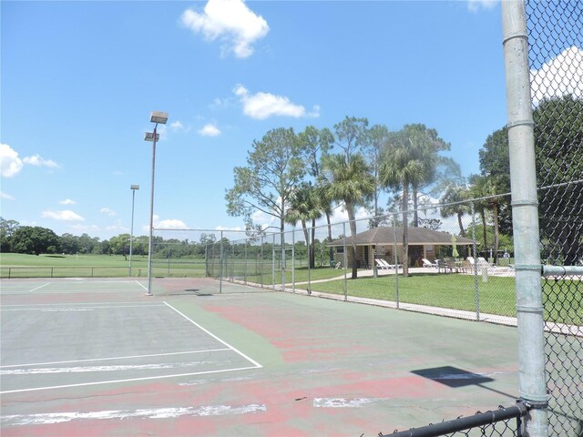 view of basketball court with a gazebo and a yard