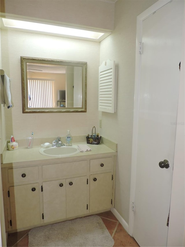 bathroom with vanity and tile patterned flooring