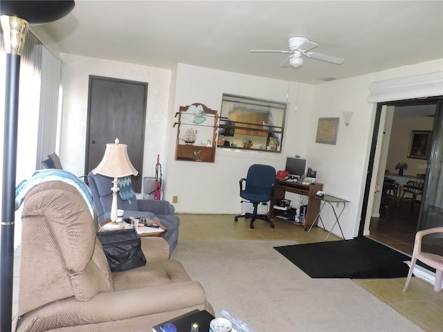 tiled living room featuring ceiling fan