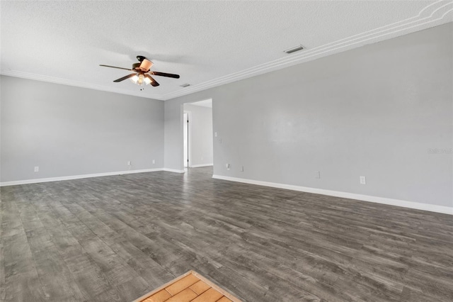 empty room featuring visible vents, a ceiling fan, dark wood-style flooring, crown molding, and a textured ceiling