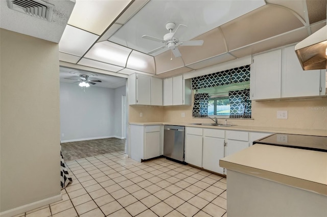 kitchen featuring white cabinets, light countertops, and stainless steel dishwasher