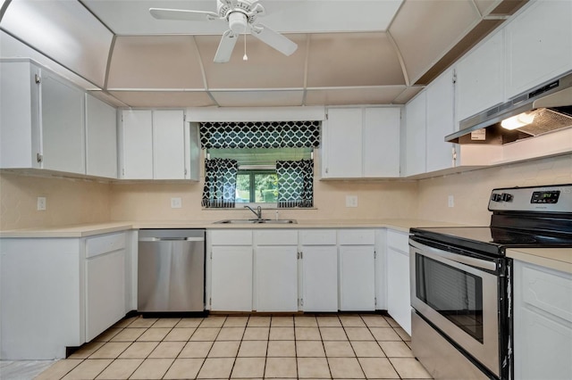 kitchen featuring light countertops, appliances with stainless steel finishes, a sink, and white cabinets