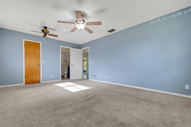 unfurnished bedroom with carpet, visible vents, ceiling fan, a textured ceiling, and baseboards