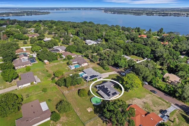 birds eye view of property featuring a water view and a residential view