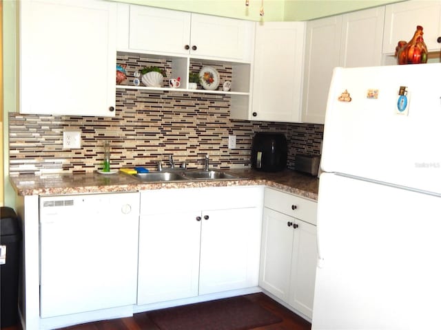 kitchen featuring decorative backsplash, white cabinets, dark wood-type flooring, white appliances, and sink