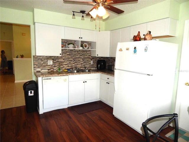 kitchen with white cabinetry, dark hardwood / wood-style floors, backsplash, and white appliances