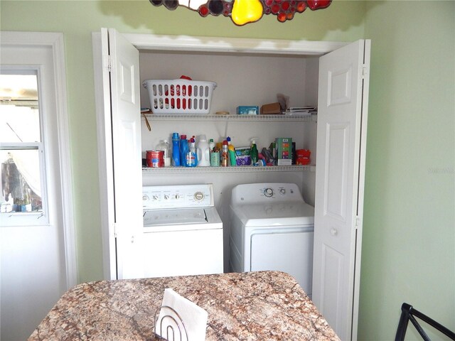 clothes washing area featuring independent washer and dryer
