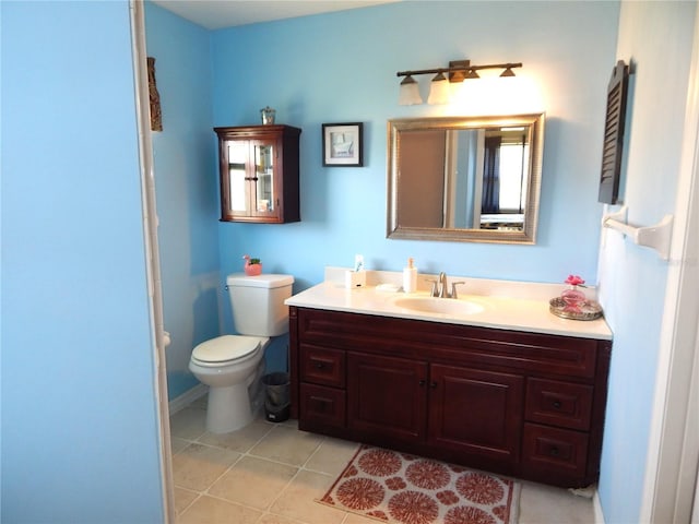 bathroom with tile patterned floors, vanity, and toilet