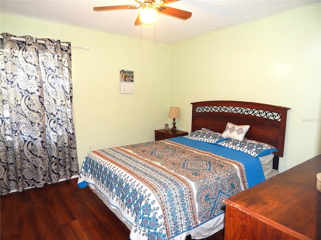 bedroom featuring ceiling fan, a textured ceiling, and hardwood / wood-style floors