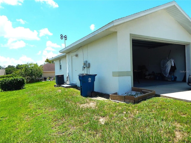 view of home's exterior featuring an outbuilding, a yard, and a garage