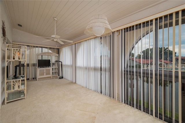 interior space featuring wood ceiling, visible vents, and a ceiling fan