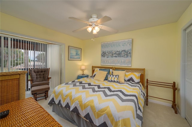 carpeted bedroom with a ceiling fan, baseboards, and a closet