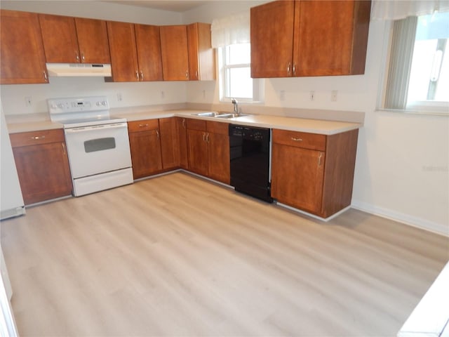 kitchen with black dishwasher, white electric stove, light countertops, under cabinet range hood, and a sink