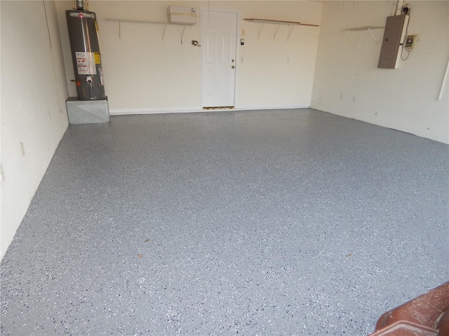 garage featuring gas water heater and electric panel