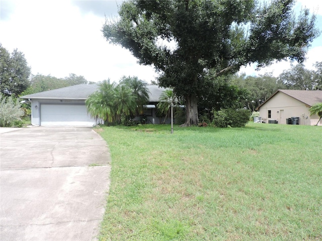 exterior space featuring a front lawn and a garage