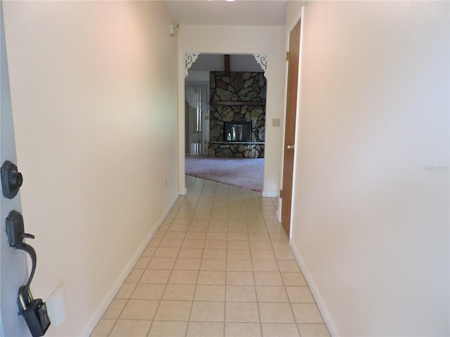 hall featuring light tile patterned flooring