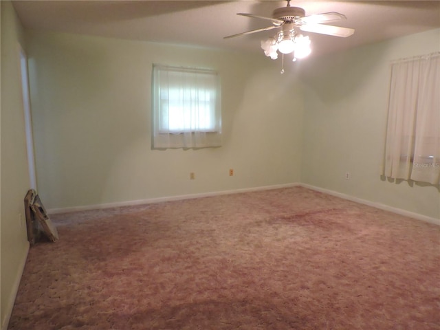 spare room with carpet and ceiling fan