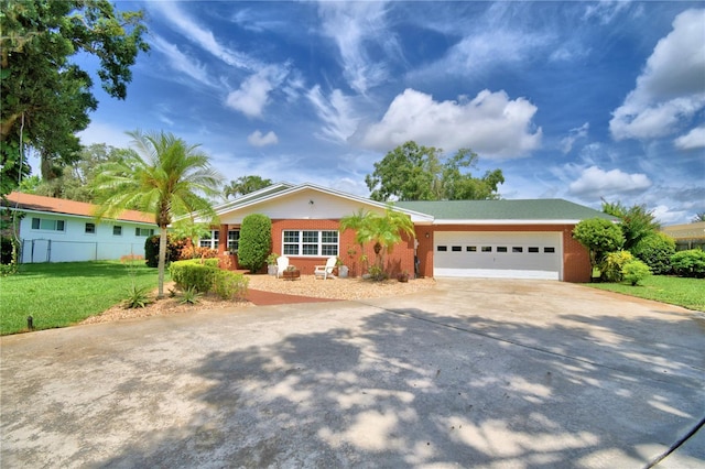 ranch-style home with a garage and a front lawn