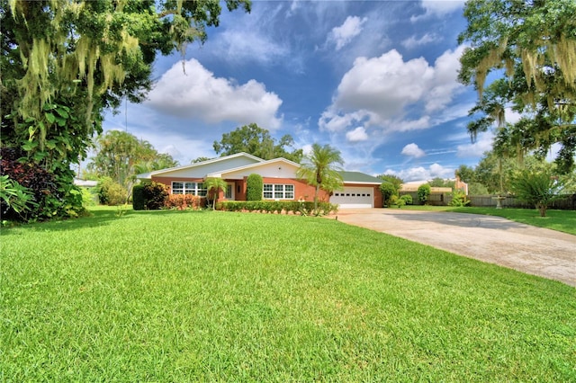 ranch-style home featuring a garage and a front lawn