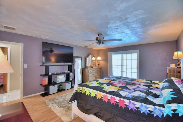 bedroom featuring ceiling fan and hardwood / wood-style floors