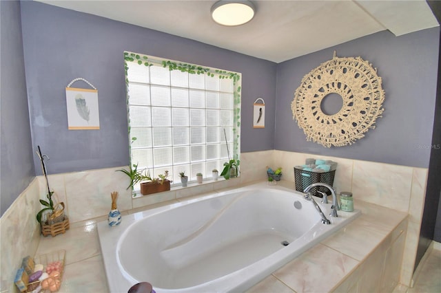 bathroom featuring a relaxing tiled tub