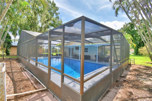 view of pool with a lanai