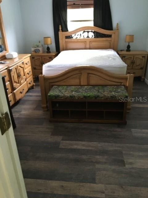 bedroom featuring dark hardwood / wood-style floors