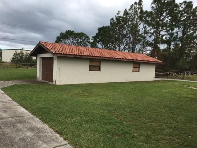 view of home's exterior with a yard