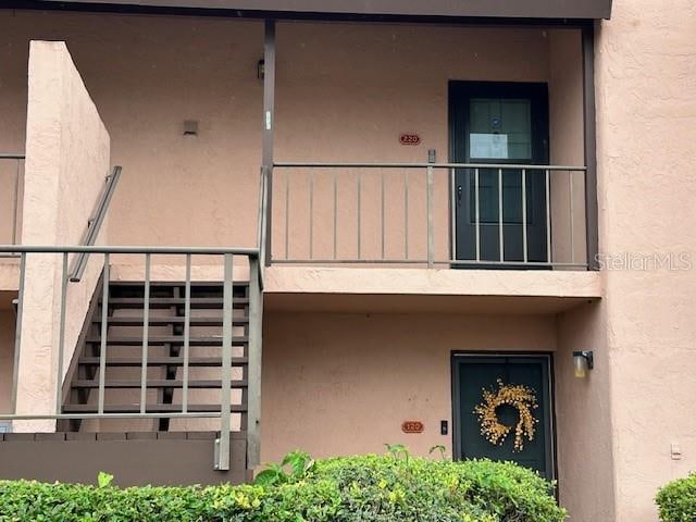 entrance to property with a balcony