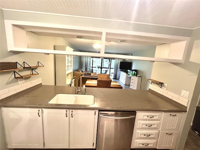 kitchen featuring ornamental molding, white cabinets, sink, and stainless steel dishwasher