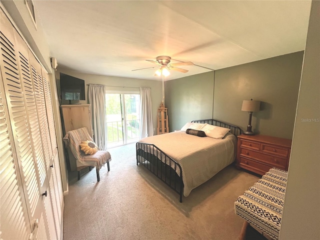 bedroom featuring access to exterior, ceiling fan, and carpet floors