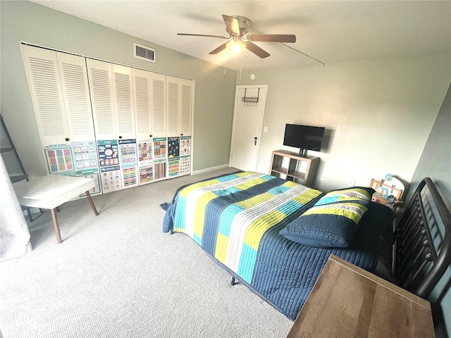 carpeted bedroom with a closet and ceiling fan