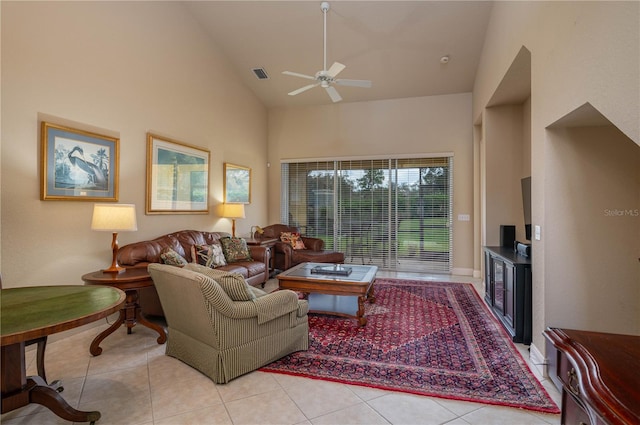 living room with ceiling fan, light tile patterned floors, and high vaulted ceiling