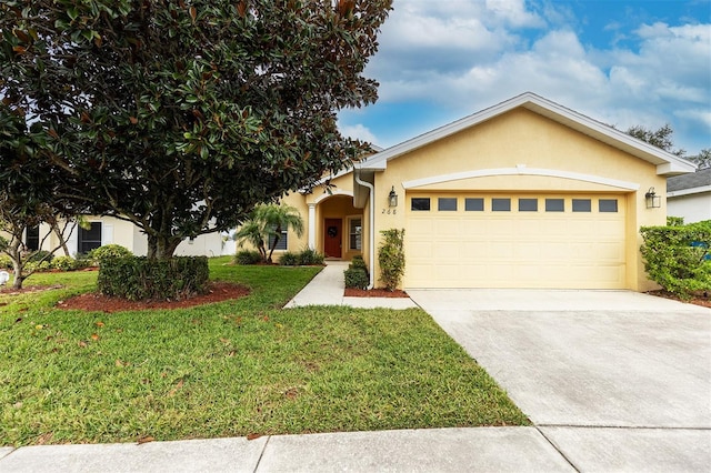 view of front of property featuring a garage and a front yard