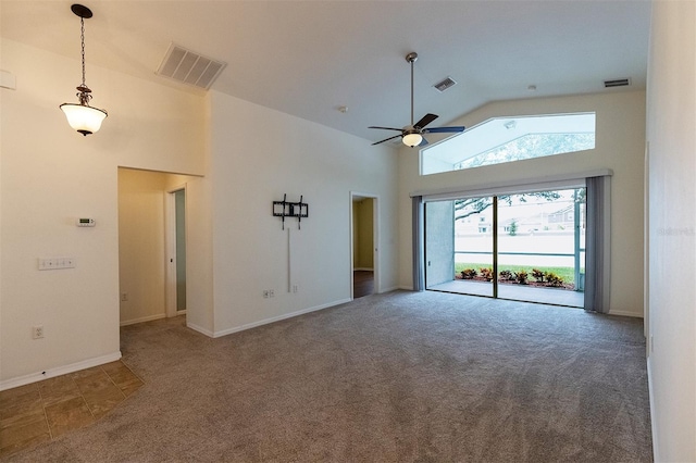 carpeted empty room featuring high vaulted ceiling and ceiling fan