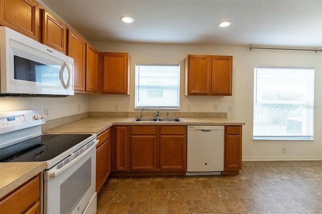 kitchen with white appliances and sink