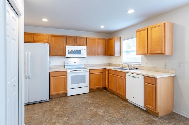 kitchen with white appliances and sink