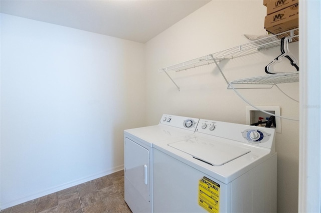 clothes washing area featuring independent washer and dryer