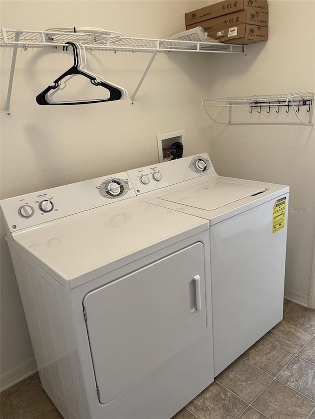 clothes washing area featuring washing machine and dryer