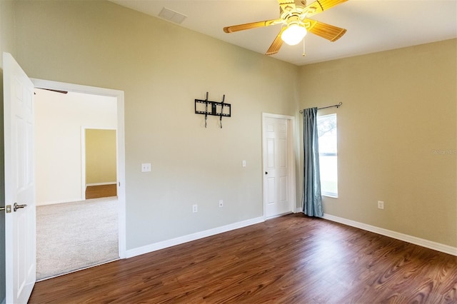 empty room featuring ceiling fan and wood-type flooring