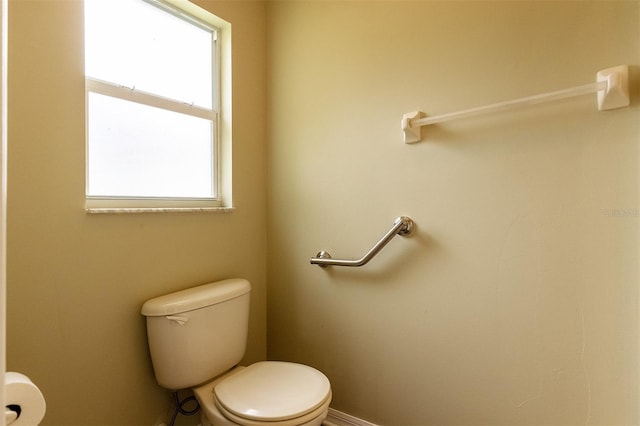 bathroom featuring a healthy amount of sunlight and toilet