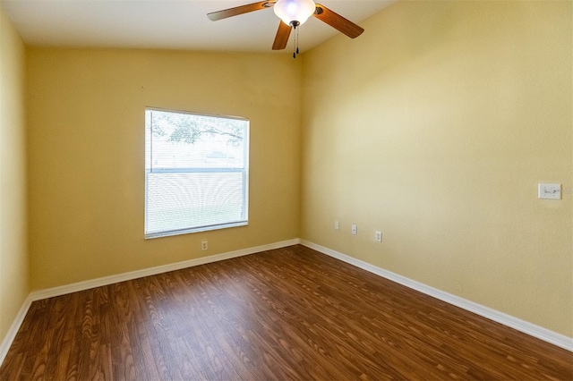 unfurnished room featuring dark hardwood / wood-style flooring, ceiling fan, and vaulted ceiling