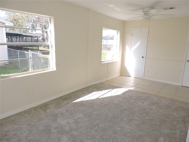 carpeted empty room with ceiling fan