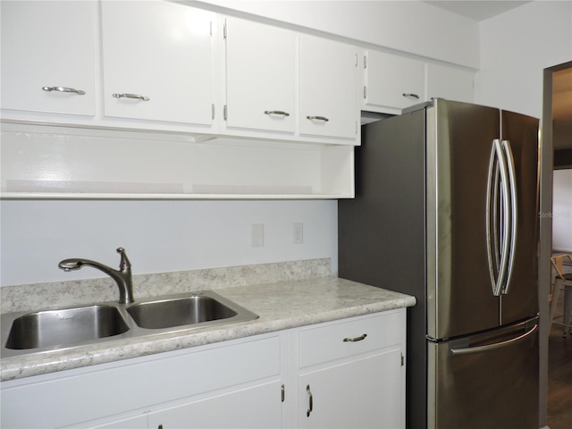 711 Springer Dr Unit 2, Lake Wales, FL 33853 - kitchen featuring freestanding refrigerator, a sink, light countertops, white cabinetry, and open shelves